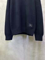Navy crewneck knit sweater with small chest logo patch