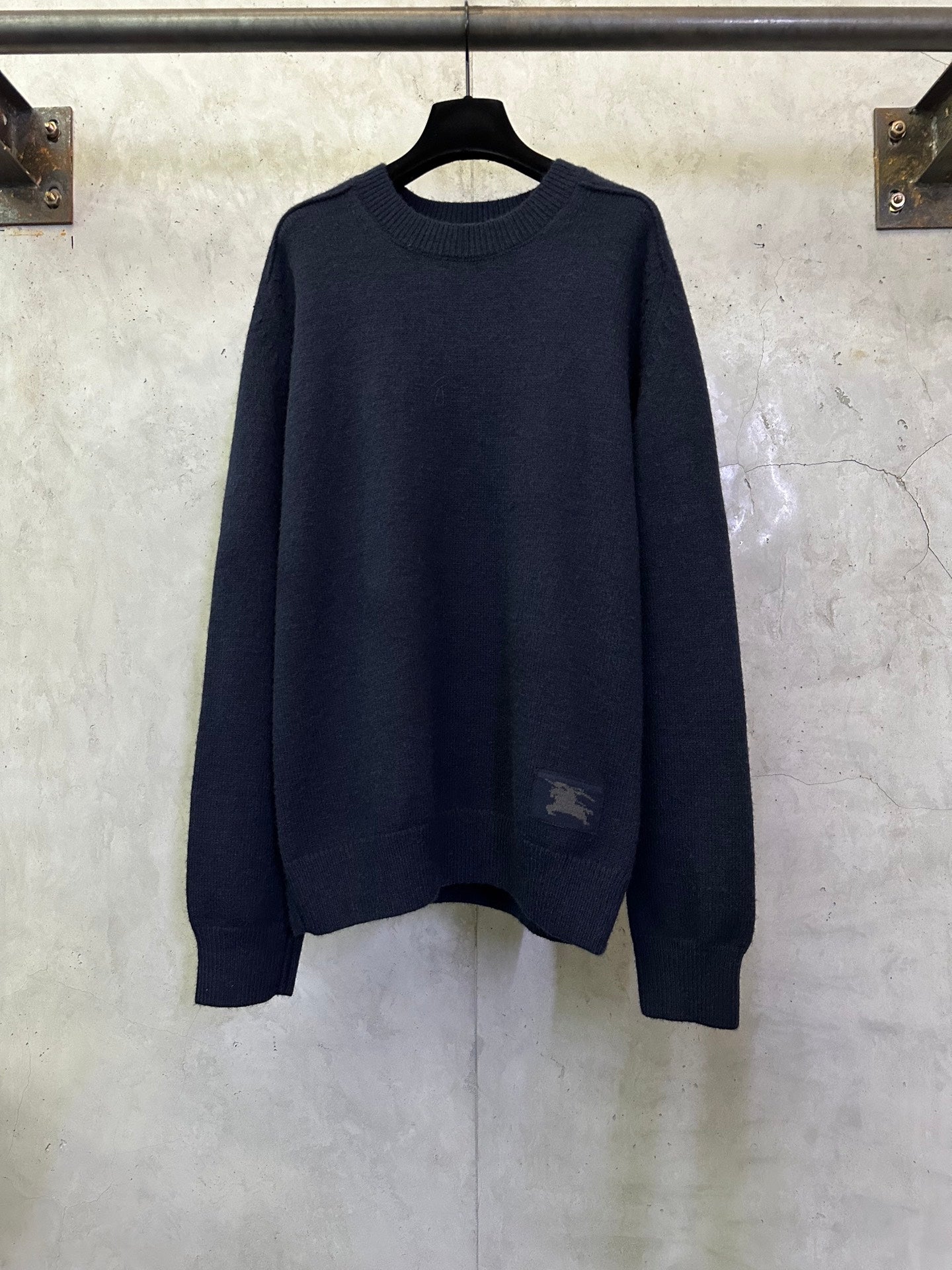 Navy long-sleeve crewneck sweater with ribbed hem and cuffs