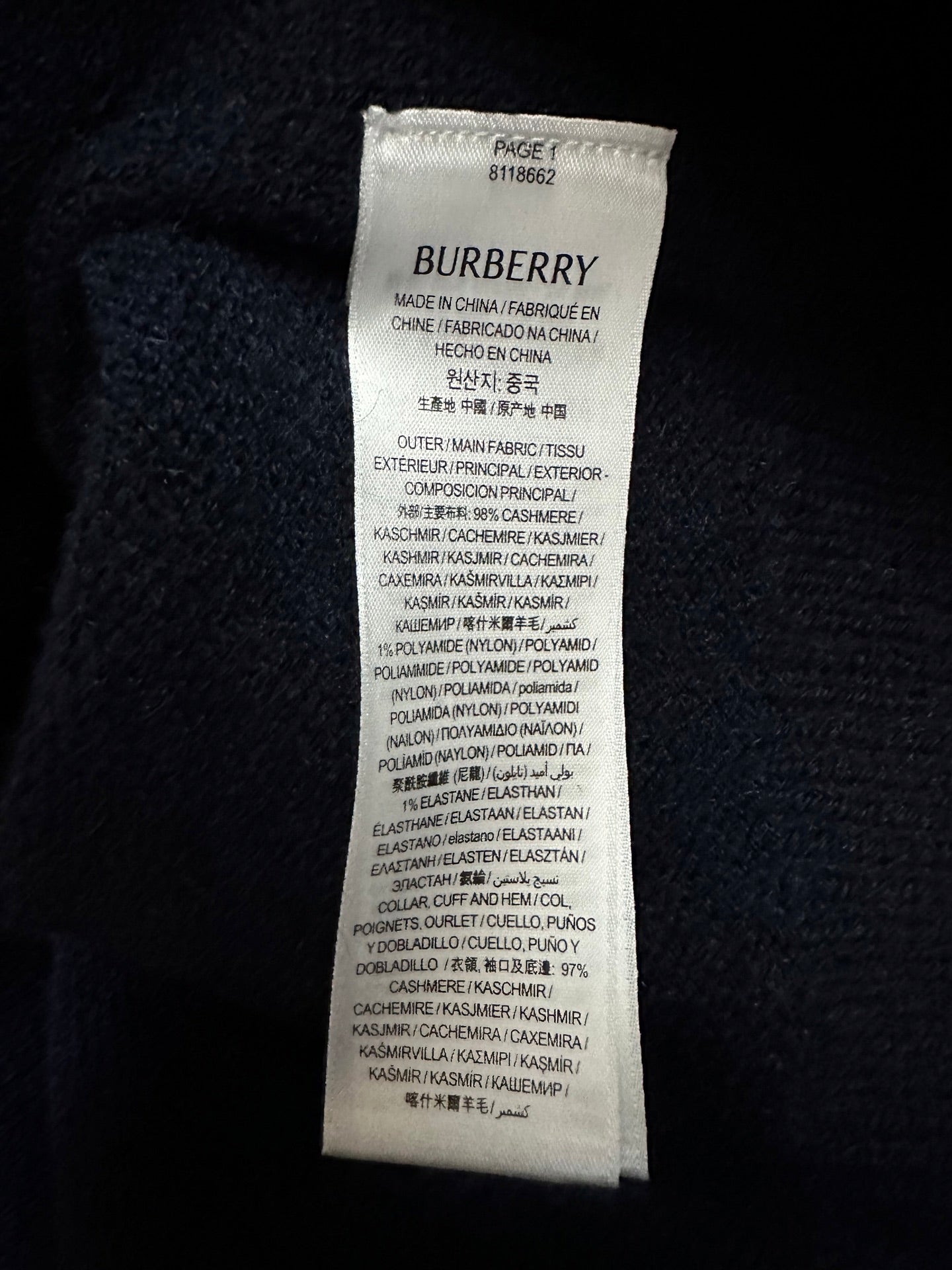Burberry fabric care label on cashmere-knit sweater interior