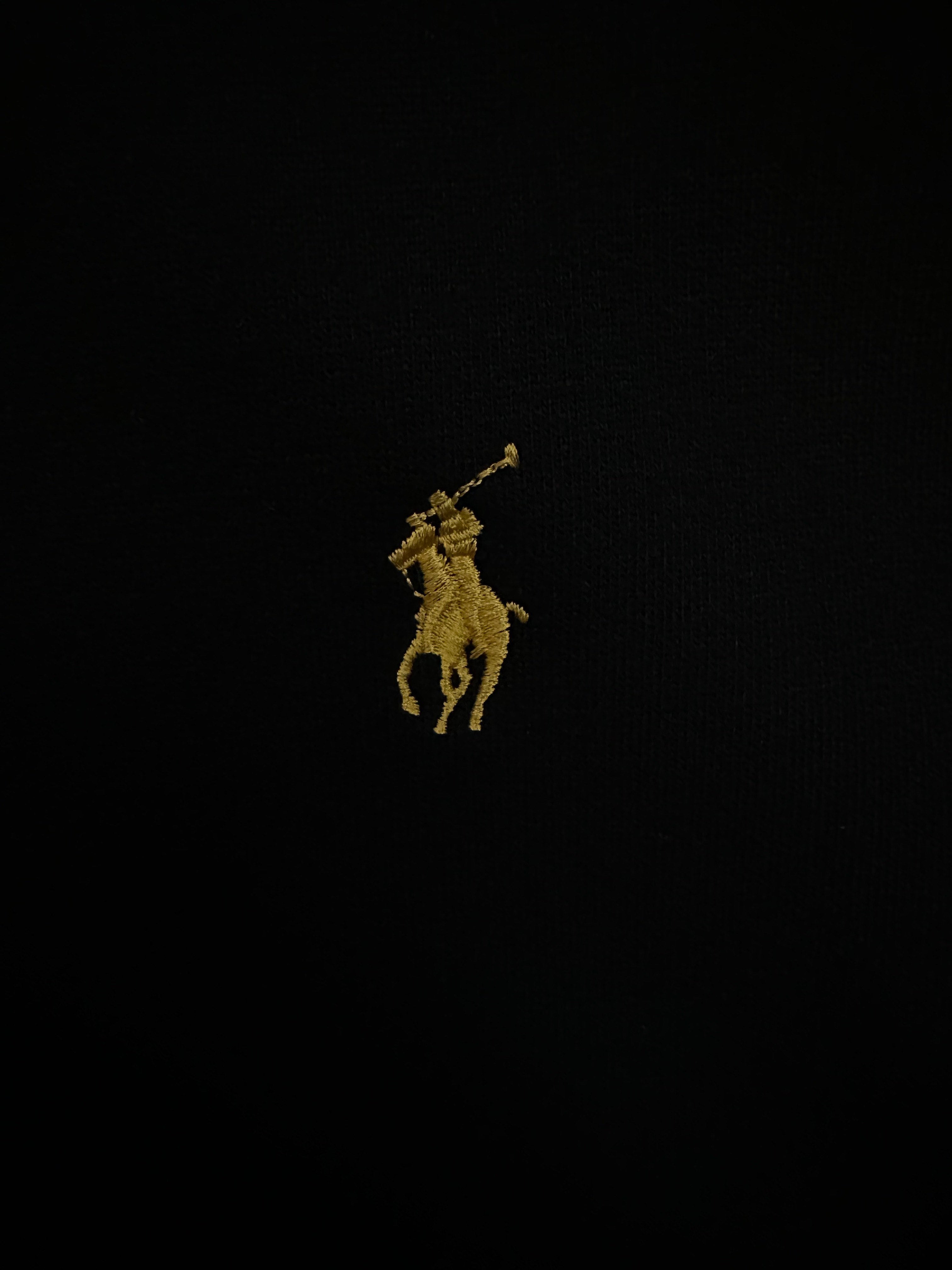 Yellow Polo player logo on black fabric