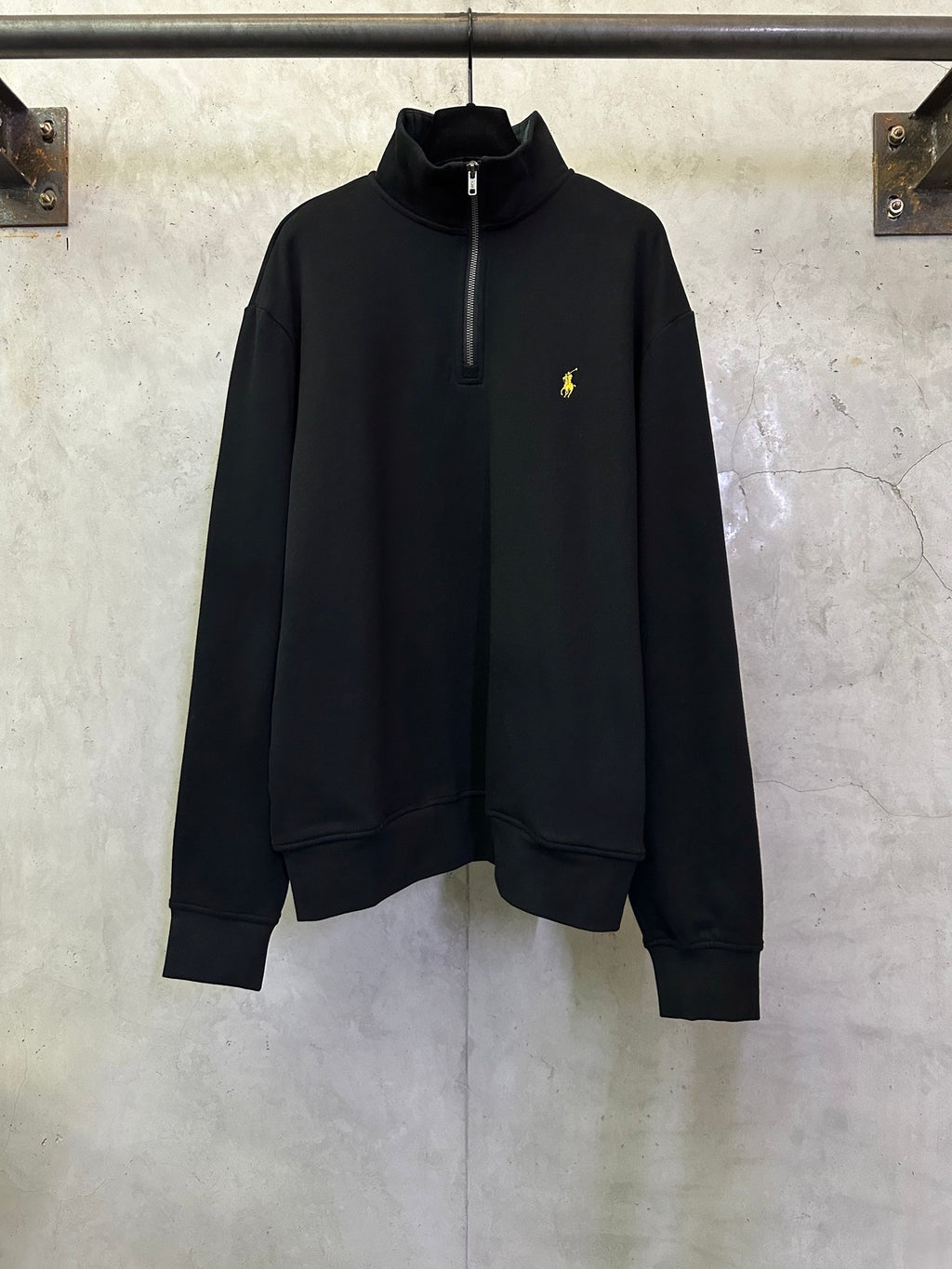Black quarter-zip sweatshirt with high collar and small Polo logo on chest