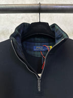 Black quarter-zip sweatshirt neckline with Polo Ralph Lauren inner tag