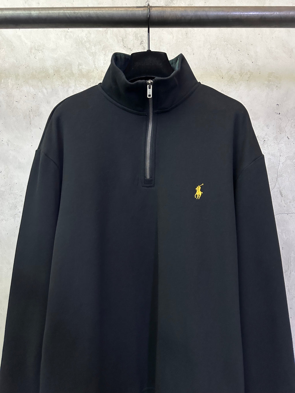 Black quarter-zip sweatshirt with zip placket and Polo logo on chest