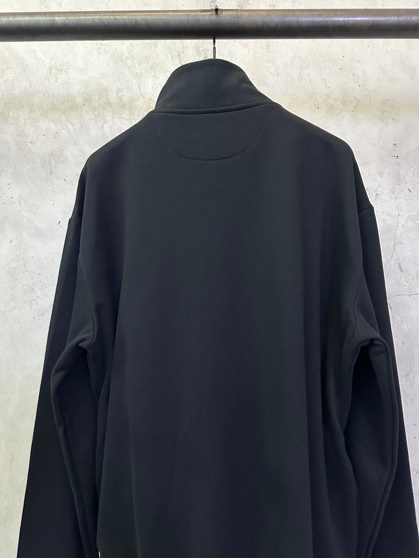 Black quarter-zip sweatshirt back view with high neck and shoulder seams