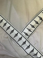 Balenciaga sleeve logo band, black symbols on light off-white fabric