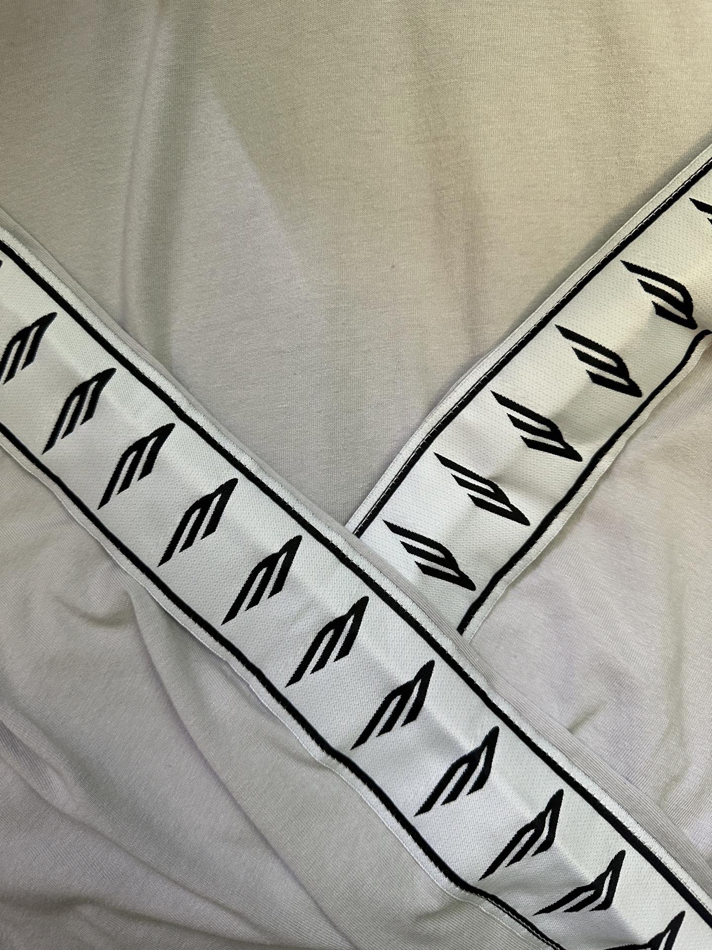 Balenciaga sleeve logo band, black symbols on light off-white fabric