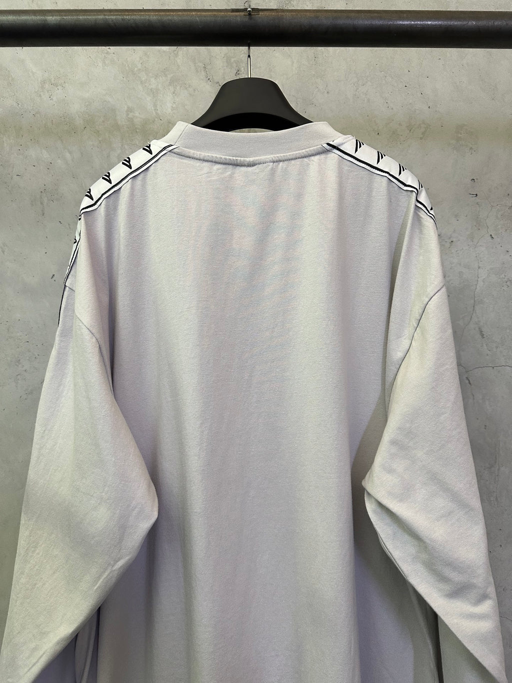 Balenciaga long-sleeve crewneck shirt, light off-white, back view with sleeve logo