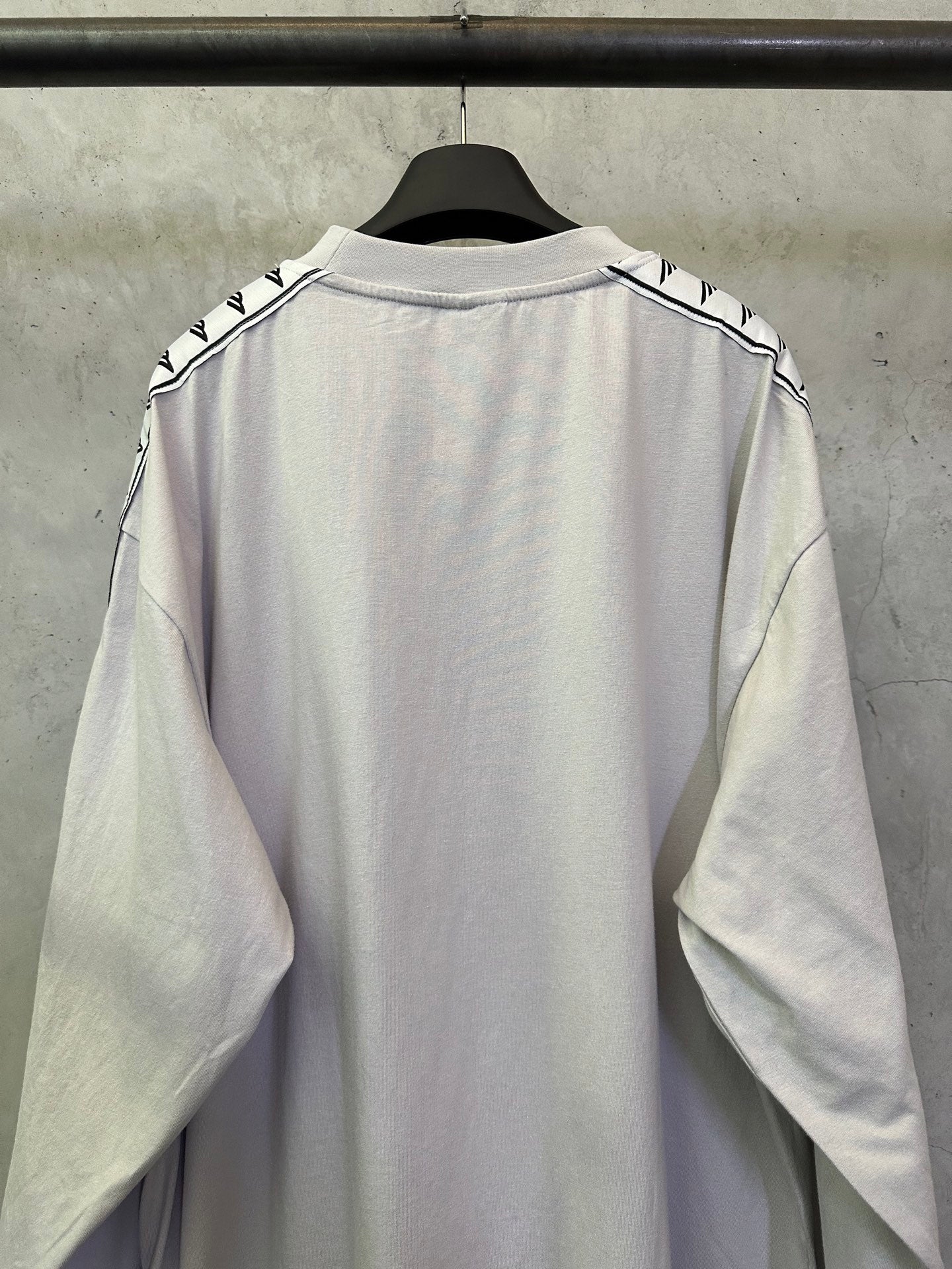 Balenciaga long-sleeve crewneck shirt, light off-white, back view with sleeve logo