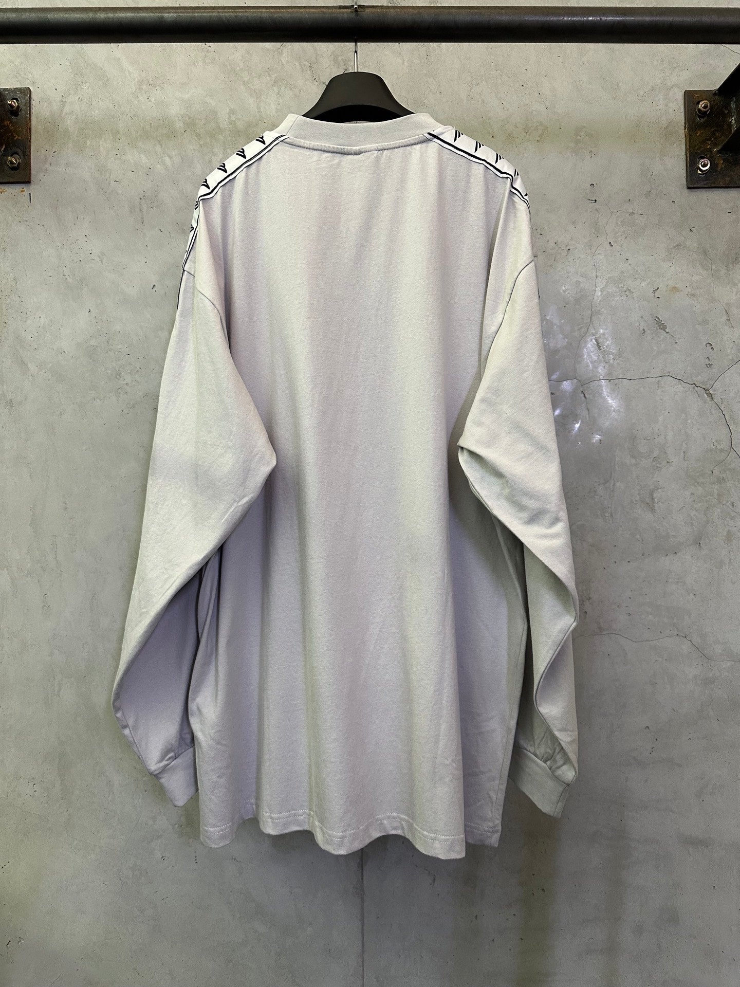 Balenciaga long-sleeve crewneck shirt, light off-white, back view, logo stripe sleeves
