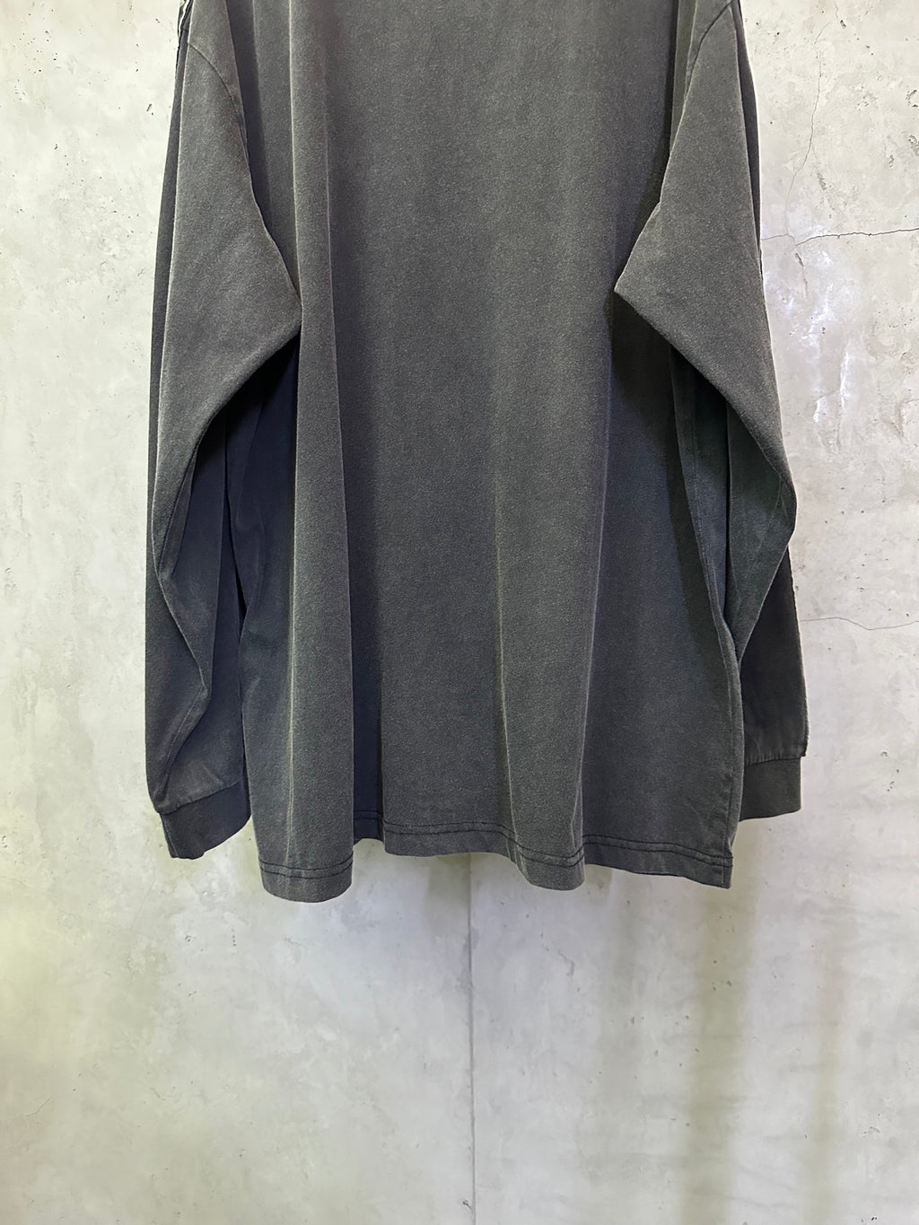 Balenciaga long-sleeve shirt, dark gray back view with logo tape at sleeves and loose hem