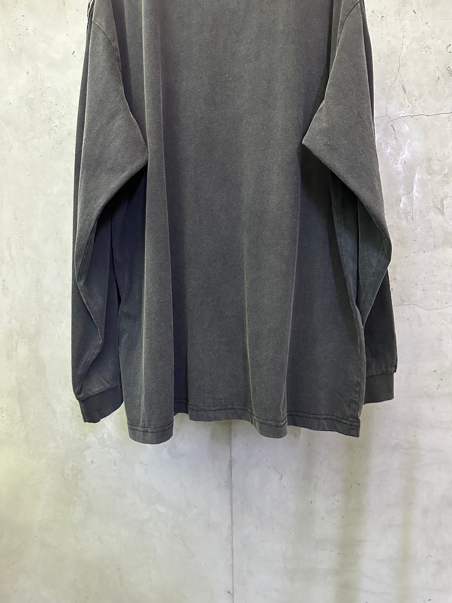 Balenciaga long-sleeve shirt, dark gray back view with logo tape at sleeves and loose hem