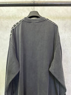 Balenciaga long-sleeve shirt, dark gray back view with white logo tape at shoulders