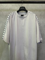 Light gray short-sleeve T-shirt with crew neck and black logo-trim shoulder details