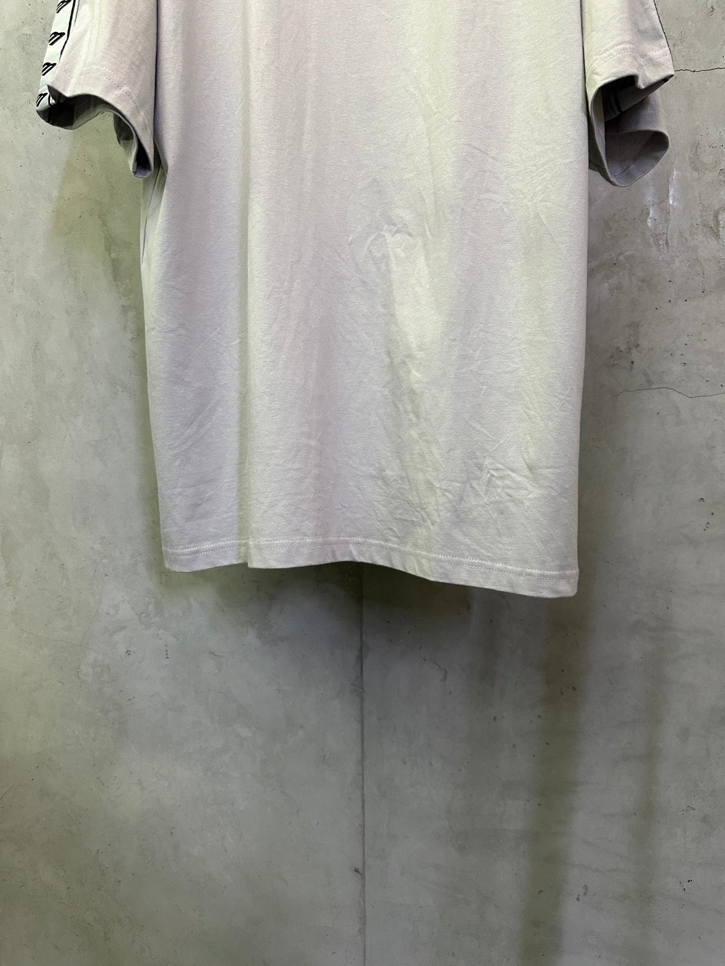 Light gray short-sleeve T-shirt front view, crew neck style, smooth jersey fabric