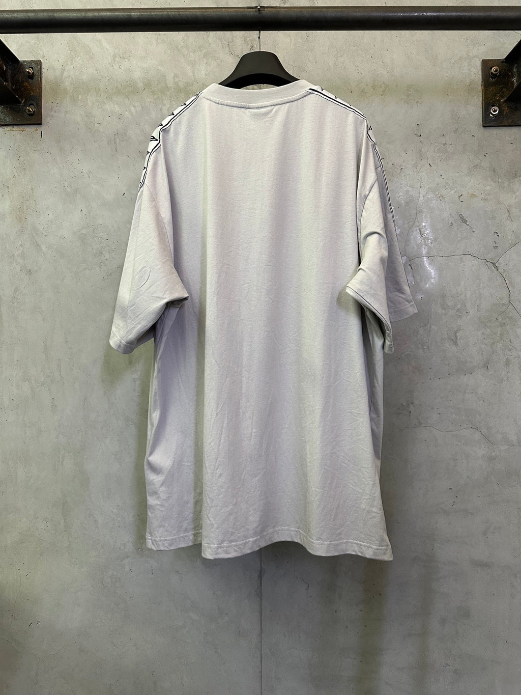 Balenciaga white T-shirt back view with black logo detail on sleeves, crew neck