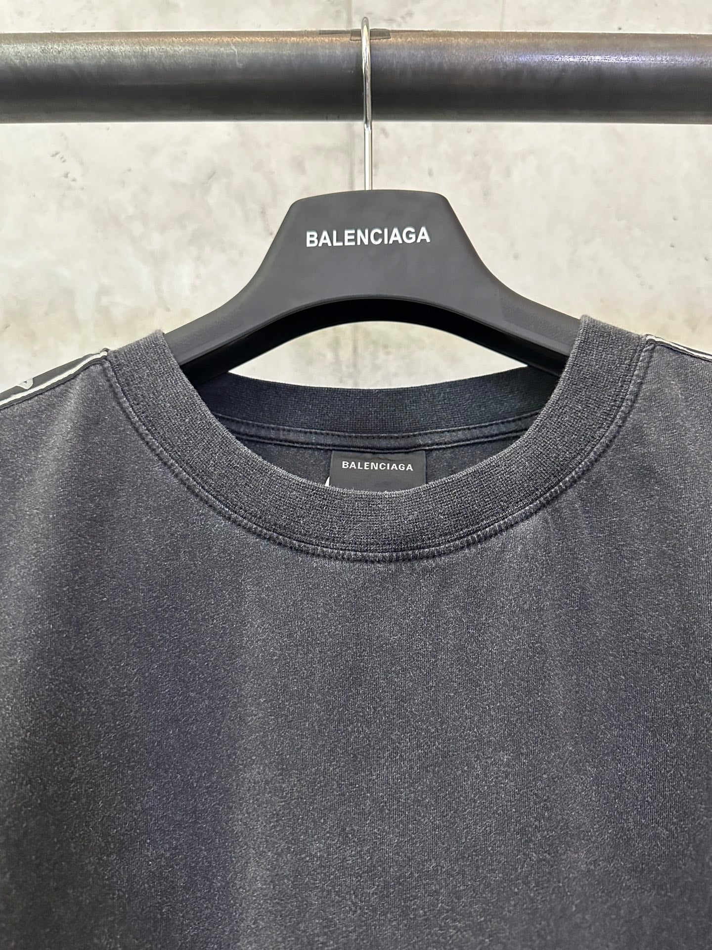 Men's black crew-neck T-shirt with BALENCIAGA label inside the neckline