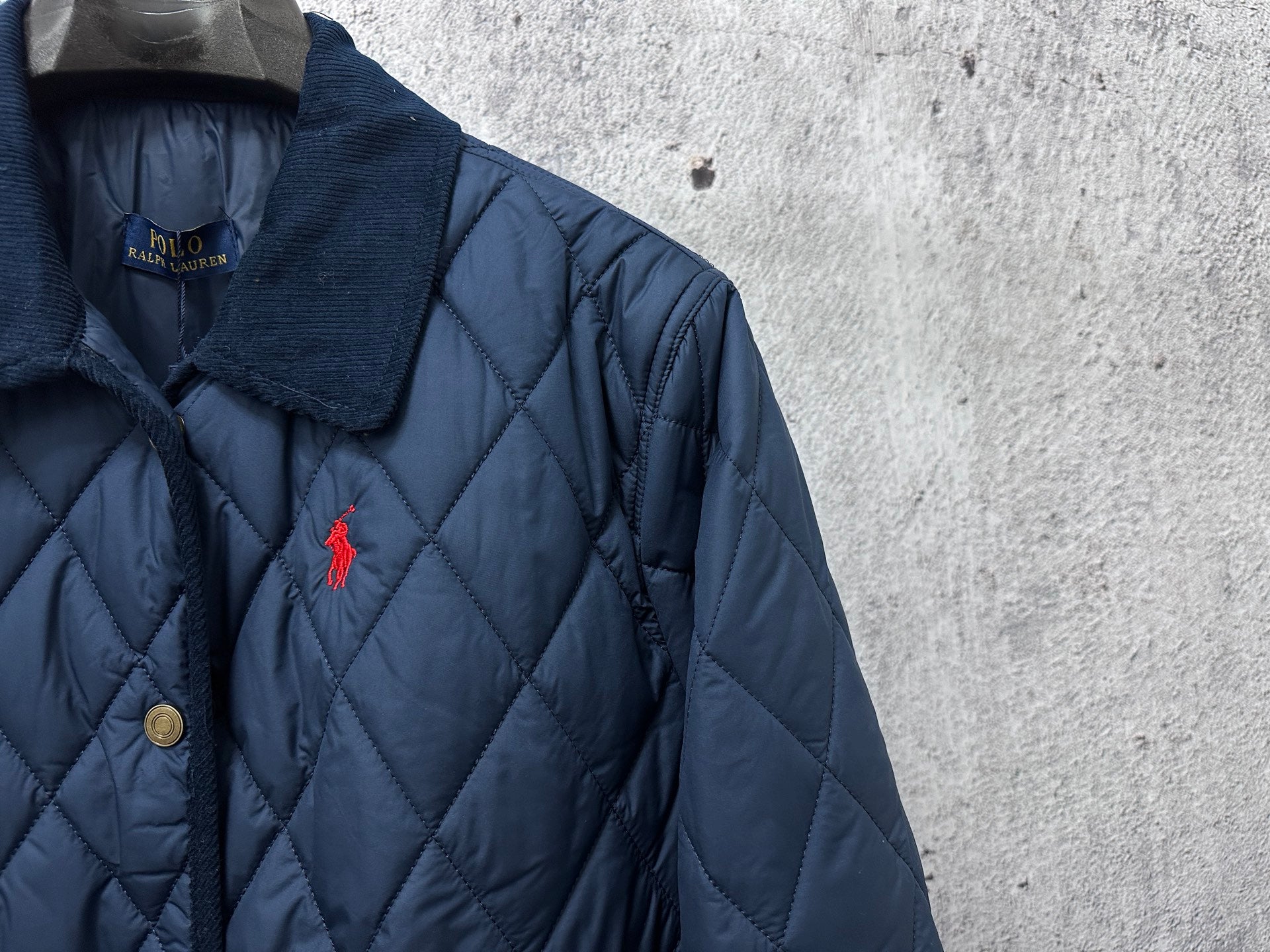Ralph Lauren quilted jacket neckline and front, navy blue, logo pony detail, button placket