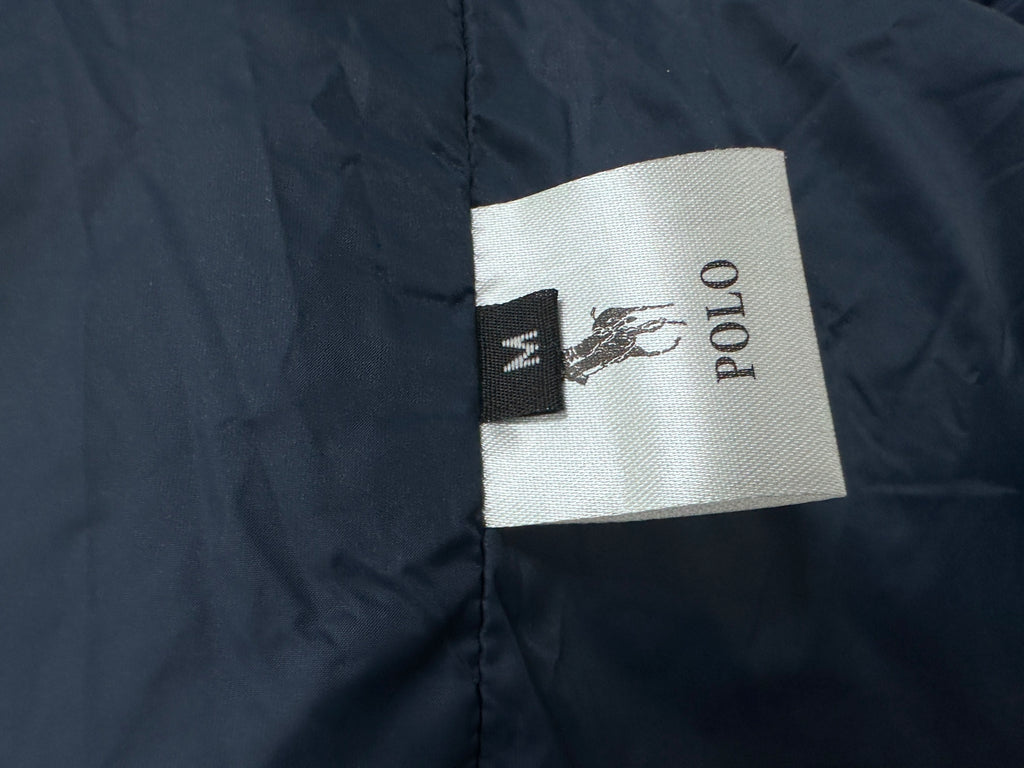 Ralph Lauren jacket size label and polo logo tag on navy blue lining