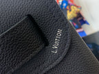 Louis Vuitton leather backpack close-up of interior pocket with embossed logo text