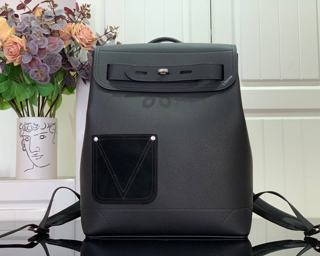 Louis Vuitton backpack in dark leather with front flap and top handle, adjustable straps