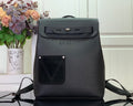 Louis Vuitton backpack in dark leather with front flap and top handle, adjustable straps