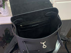 Louis Vuitton backpack interior view with open top and small zip pocket, dark lining