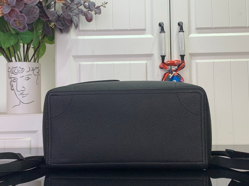 Louis Vuitton zip-top backpack in dark pebbled leather with wide front flap detail