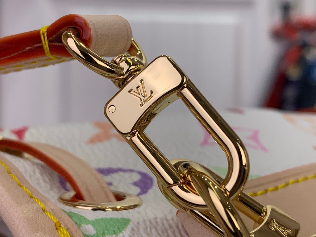 Gold-tone clasp and rings on a multicolor monogram bucket bag strap