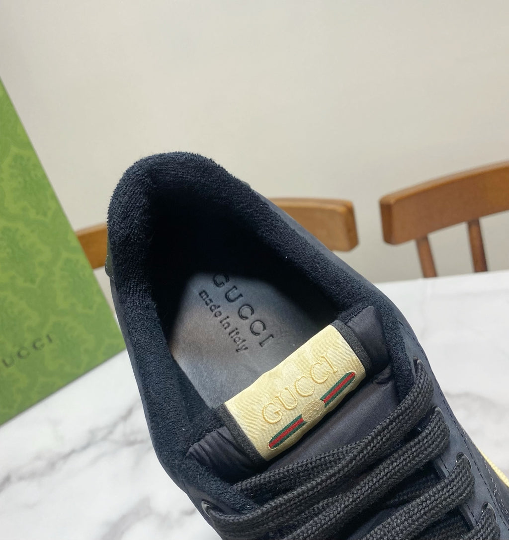 Gucci unisex sneaker heel interior in dark navy with Gucci logo patch.