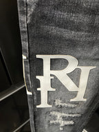 Light-wash denim jeans with large RL logo patch and distressed knee rip