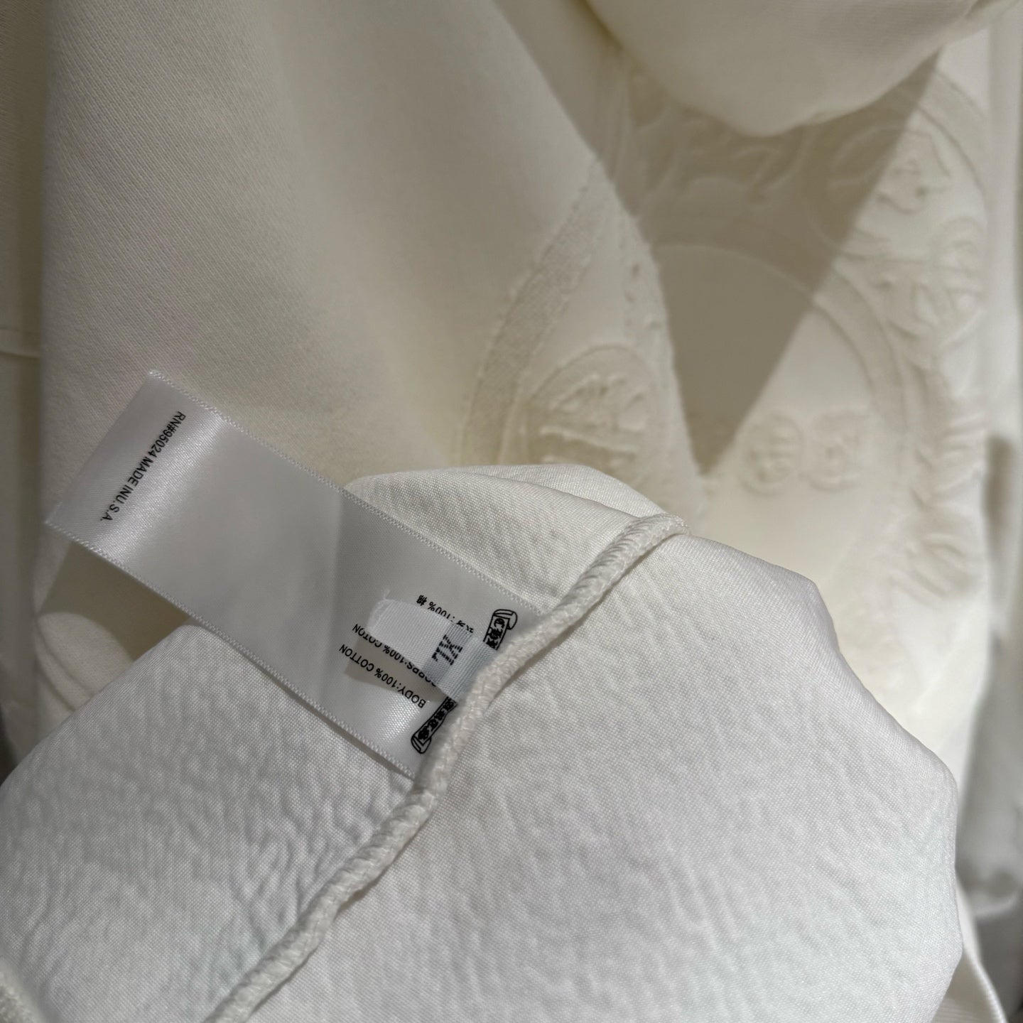 Off-white hoodie close-up of neck label and inner seam