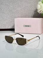 MiuMiu sunglasses with dark lenses and brown round frames, gold detail arms