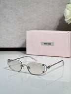 MiuMiu eyeglasses with clear lenses and silver metal round frames