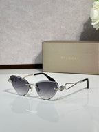 Gold-frame sunglasses with dark blue gradient lenses, front angle view