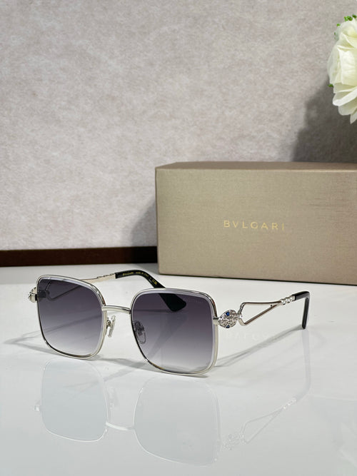 Silver sunglasses with dark lenses and gold-tone logo detail