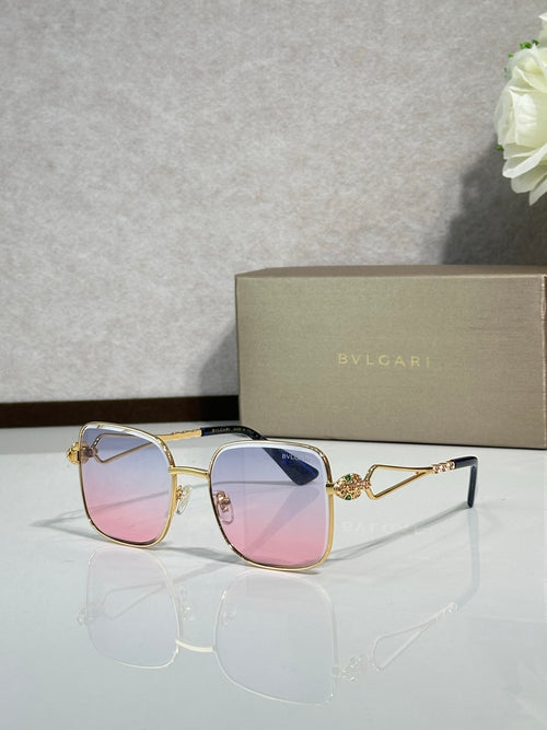 Gold sunglasses with pink-to-purple tinted lenses