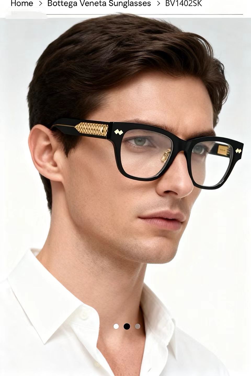 Black eyeglasses on model with gold-pattern temple and clear lenses.