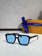 Sunglasses with black square frames and light blue tinted lenses