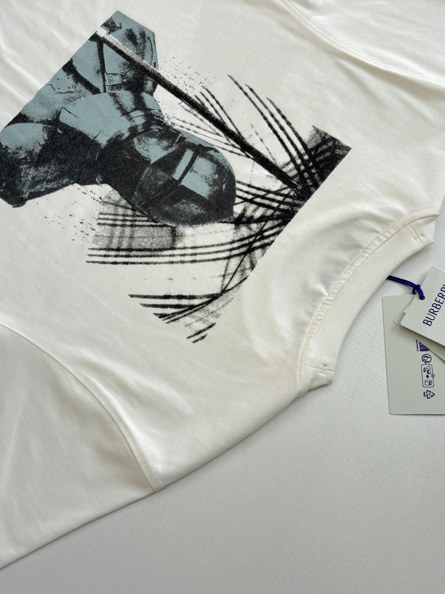 Burberry white T-shirt with large front graphic print and blue sleeve tag