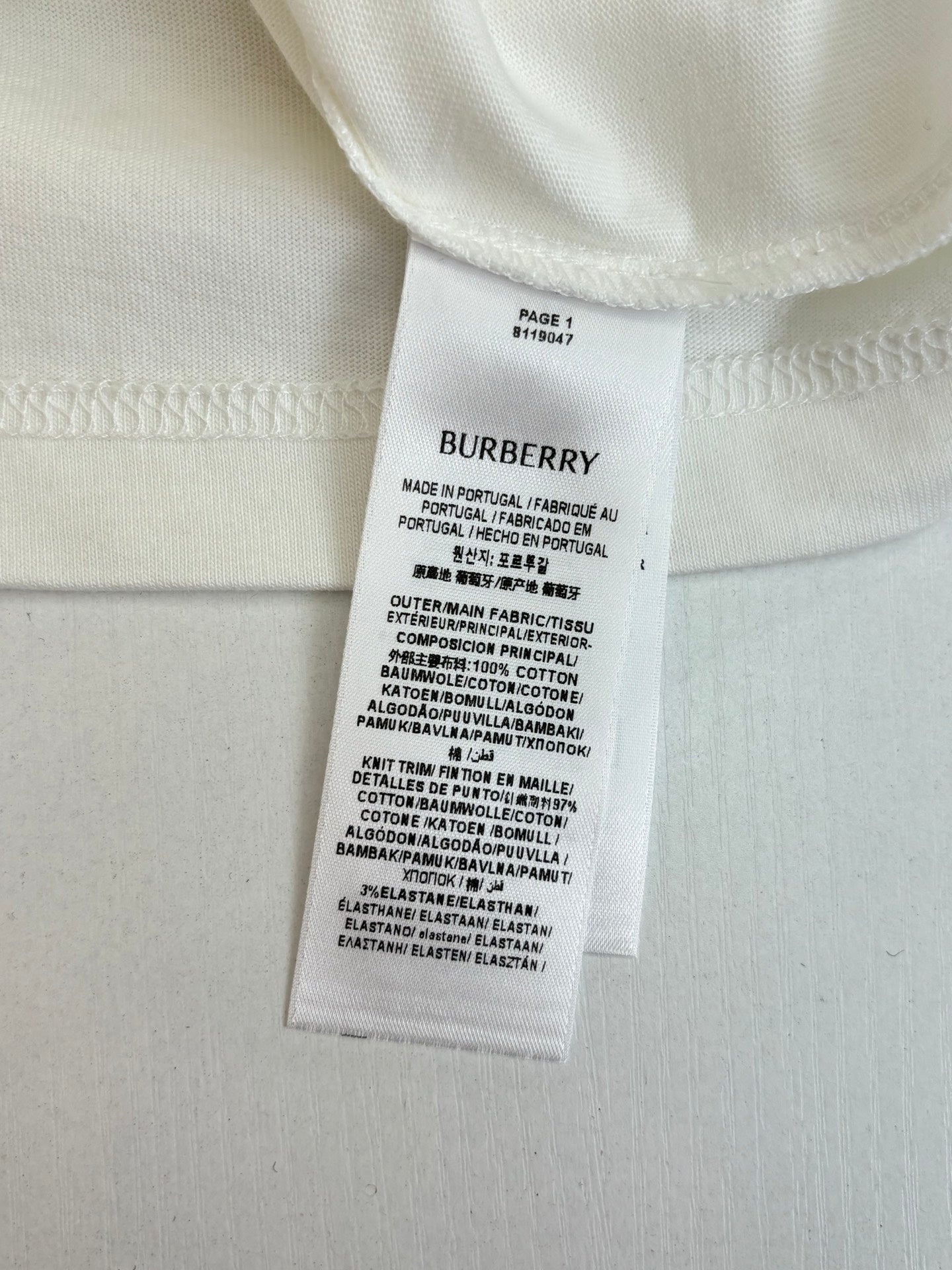 Burberry white T-shirt care and material label at neckline