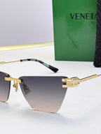 Bottega Veneta sunglasses, gold arms and blue-gray gradient lenses