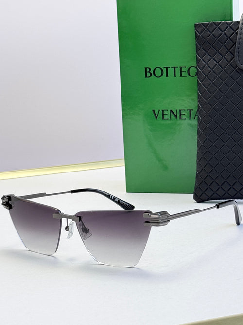 Bottega Veneta sunglasses with dark frame and cool gray gradient lenses