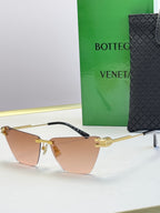 Bottega Veneta sunglasses with gold frame and light brown gradient lenses