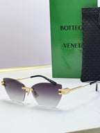 Bottega Veneta sunglasses with gradient brown lenses, gold frame and tortoise temple