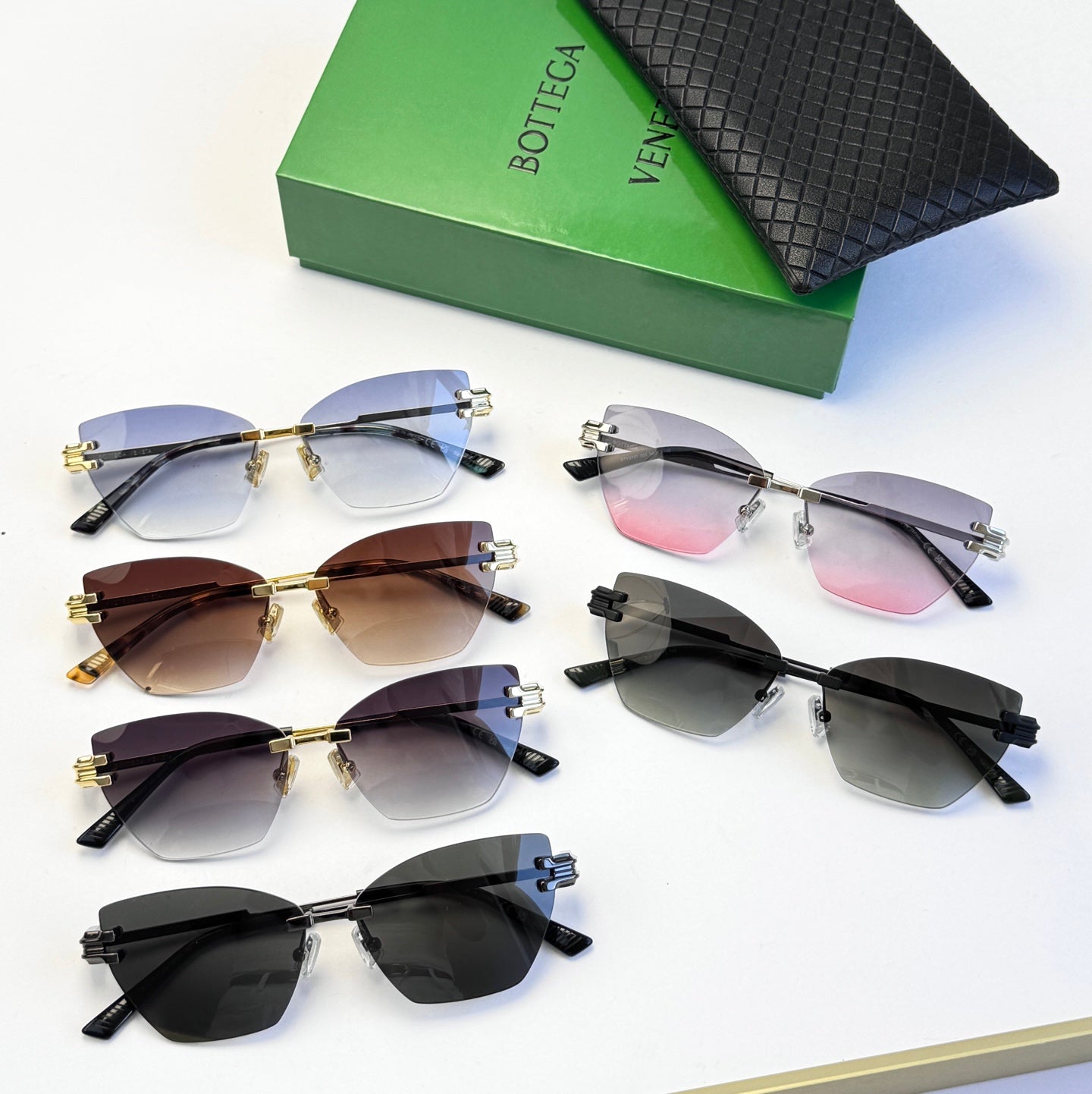 Bottega Veneta sunglasses set with assorted frames and tinted lenses on a display