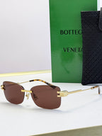 Bottega Veneta sunglasses with gold frame and brown gradient lenses