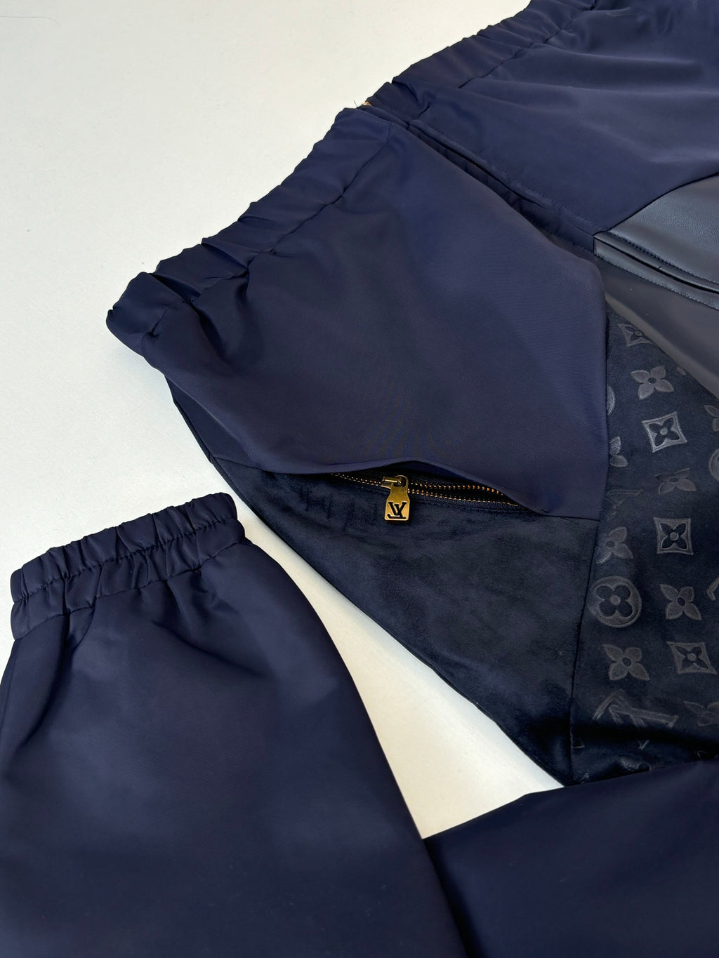 Navy jacket and pants set; elastic waist pants with cuffed leg openings