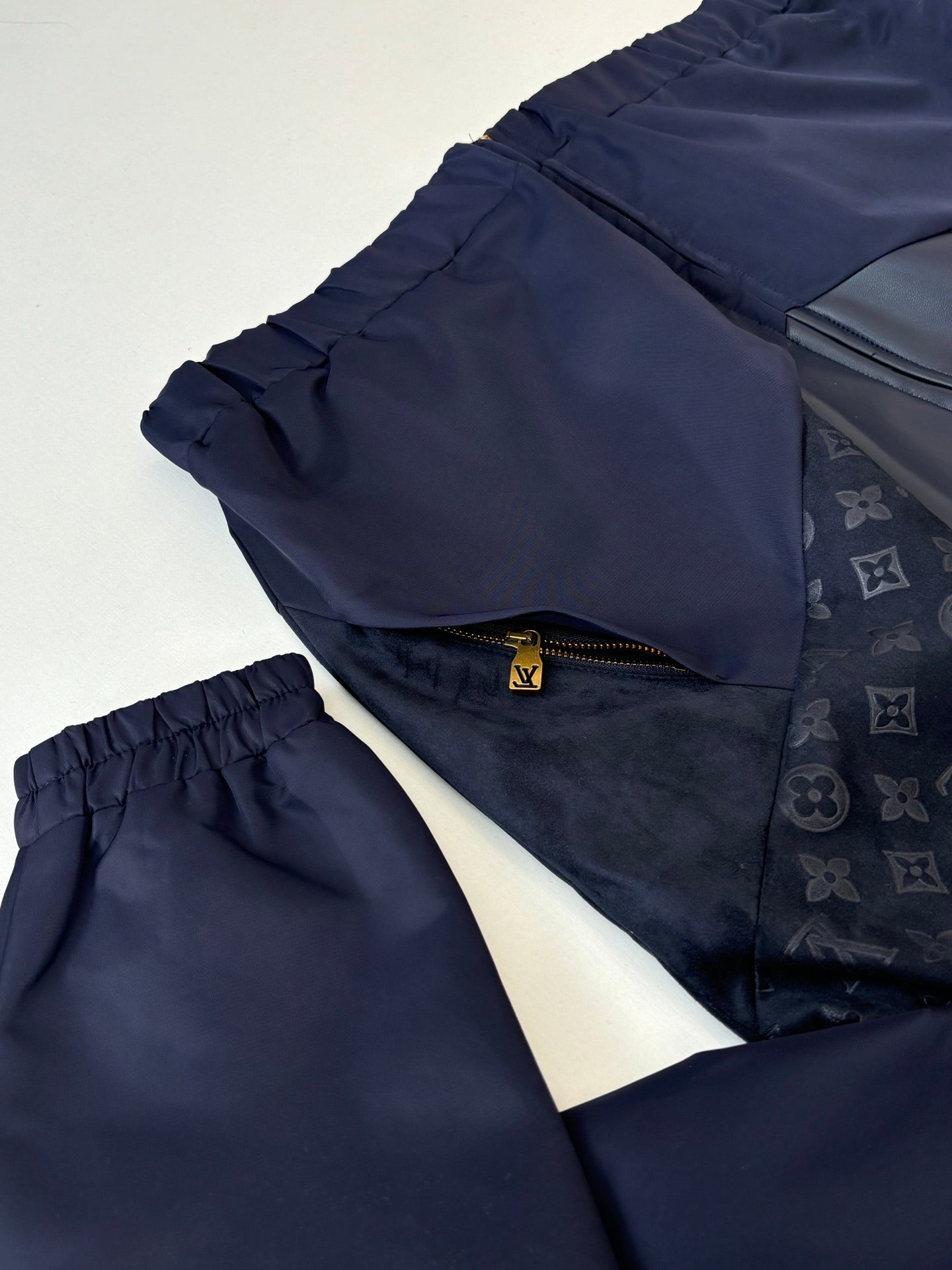 Navy jacket and pants set; elastic waist pants with cuffed leg openings
