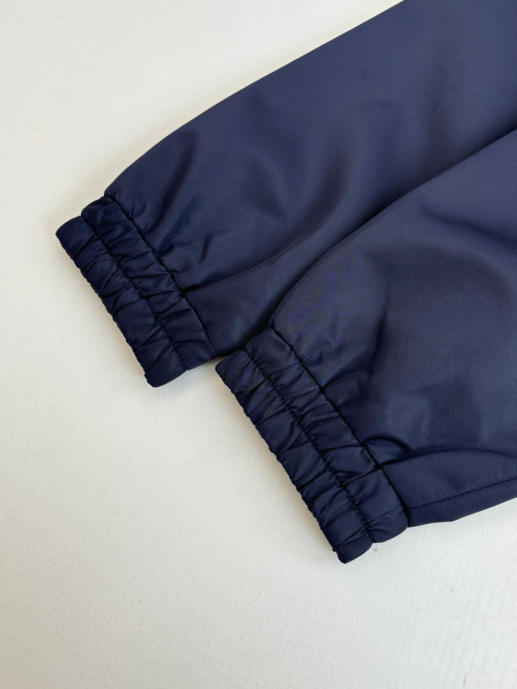 Navy long pants with gathered elastic cuffs