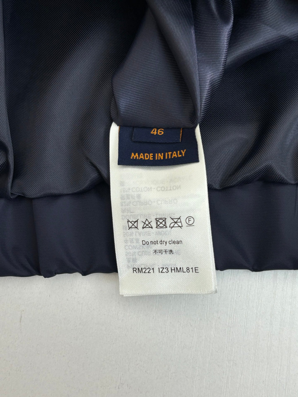 Louis Vuitton long pants size tag, Made in Italy, care symbols
